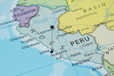 Close up to Lima city with a black pin needle into Peru country political mapの写真素材