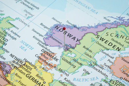 Close up to a Moss city with a red pin needle into Norway country political mapの写真素材
