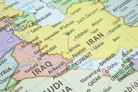 Close up to a Ahvaz city with a green pin needle into Iran country political mapの写真素材