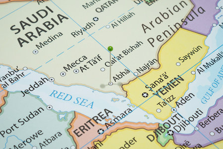 Close up to a Abha city with a green pin needle into Saudi Arabia country political mapの写真素材