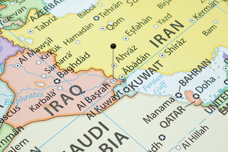 Close up to a Basra city with a black pin needle into Iraq country political mapの写真素材