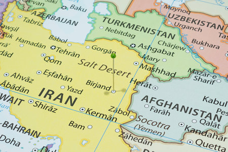 Close up to a Birjand city with a green pin needle into Iran country political mapの写真素材