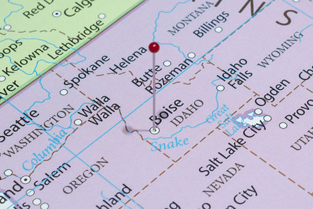 Close up to a Boise city with a red pin needle into United States of America country political map