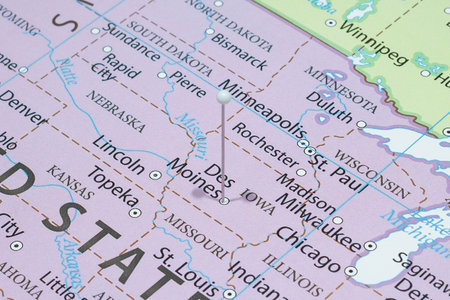 Close up to a Des Moines city with a white pin needle into United States of America country...