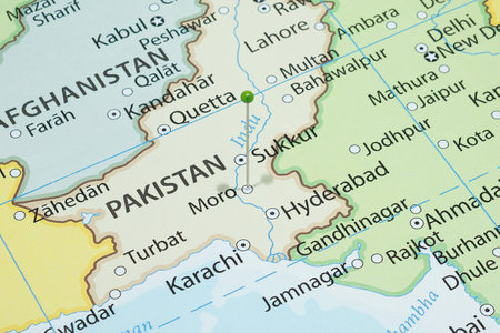 Close up to a Moro city with a green pin needle into Pakistan country political mapの写真素材