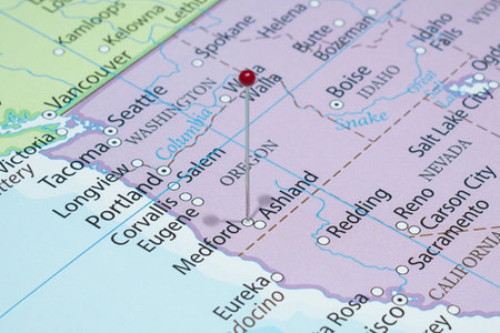 Close up to a Medford city with a red pin needle into United States of America country political map