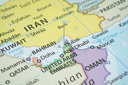 Close up to a Dubai city with a white pin needle into United Arab Emirates country political mapの写真素材