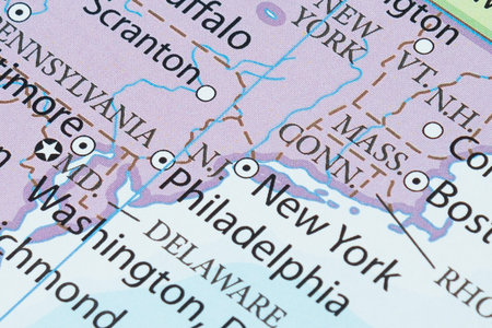 Macro photography of New York city into political United States of America map with important cities