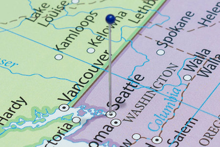 Close up to a Seattle city with a blue pin needle into United States of America country political...