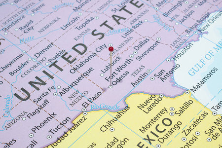 Close up to a Odessa city with a red pin needle into United States of America country political mapの写真素材