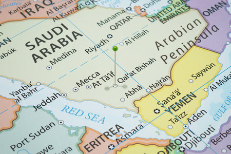 Close up to a Qal At Bishah city with a green pin needle into Saudi Arabia country political map