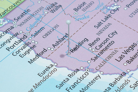 Close up to a Redding city with a white pin needle into United States of America country political mapの写真素材