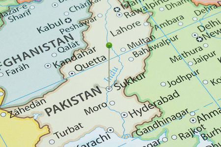 Close up to a Sukkur city with a green pin needle into Pakistan country political map