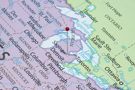 Close up to a Saginaw city with a red pin needle into United States of America country political mapの写真素材
