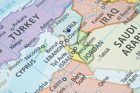 Close up to a Tel Aviv city with a blue pin needle into Israel country political mapの写真素材