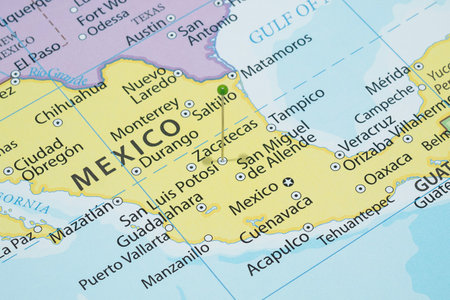Close up to a San Luis Potosi city with a green pin needle into Mexico country political mapの写真素材