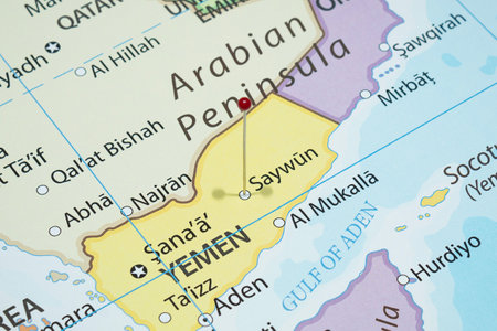 Close up to a Saywun city with a red pin needle into Yemen country political mapの写真素材