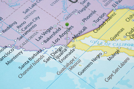 Close up to a Tijuana city with a green pin needle into Mexico country political mapの写真素材