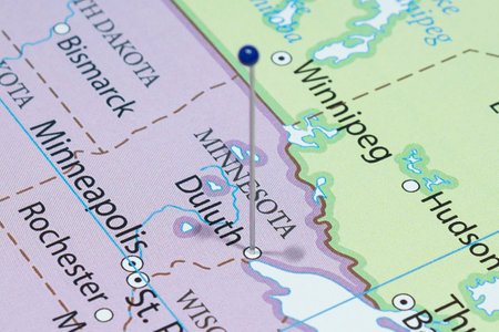 Close up to a Duluth city with a blue pin needle into United States of America country political mapの写真素材
