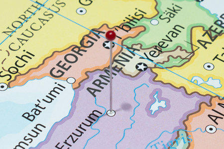 Close up to a Erzurum city with a red pin needle into Turkey country political map