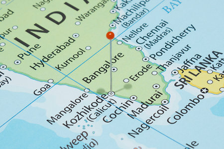 Close up to a Calicut city with an orange pin needle into India country political mapの写真素材