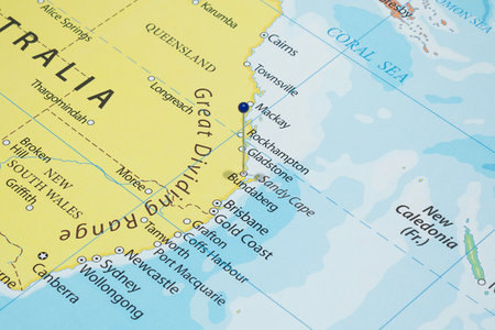 Close up to a Bundaberg city with a blue pin needle into Australia country political mapの写真素材
