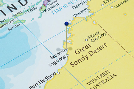 Close up to a Broome city with a blue pin needle into Australia country political map