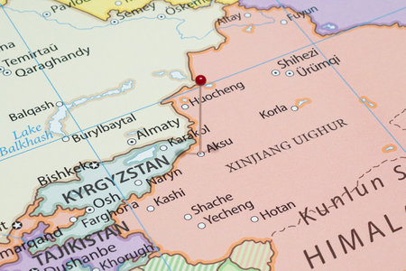 Close up to a Aksu city with a red pin needle into China country political mapの写真素材