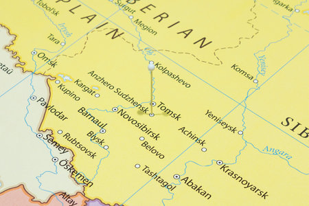 Close up to an Anzhero Sudzhensk city with a white pin needle into Russia country political mapの写真素材