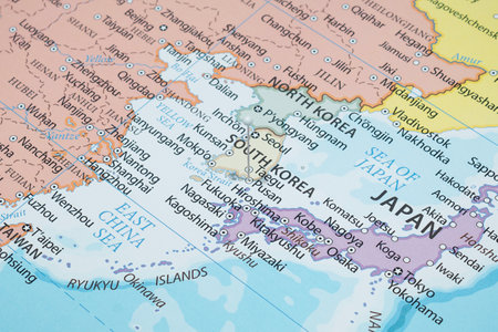 Close up to a Busan city with a white pin needle into South Korea country political mapの写真素材