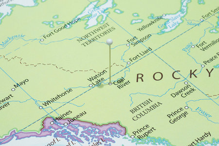 Close up to a Coal River city with a white pin needle into Canada country political mapの写真素材