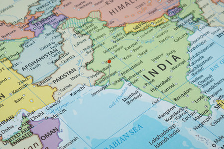 Close up to a Jamnagar city with an orange pin needle into India country political mapの写真素材