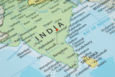 Close up to a Kurnool city with an orange pin needle into India country political mapの写真素材