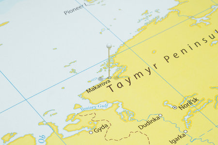 Close up to a city with a white pin needle into Russia country political mapの写真素材