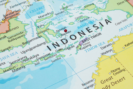 Close up to an Ende city with a red pin needle into Indonesia country political mapの写真素材