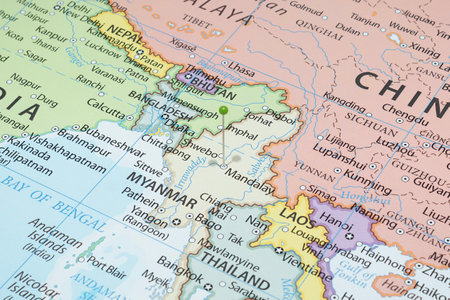 Close up to a Mandalay city with a green pin needle into Myanmar country political mapの写真素材