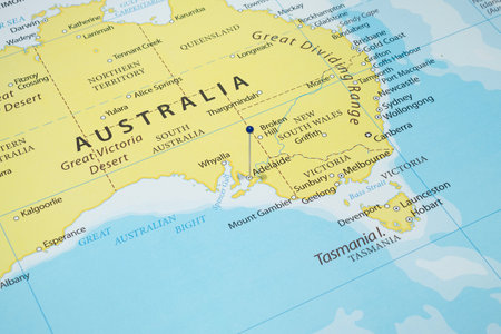 Close up to an Adelaide city with a blue pin needle into Australia country political mapの写真素材