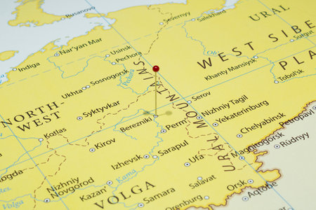Close up to a Berezniki city with a red pin needle into Russia country political mapの写真素材