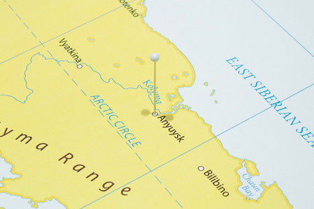 Close up to a Anyuysk city with a white pin needle into Russia country political mapの写真素材