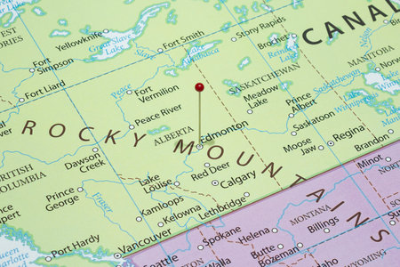 Close up to an Edmonton city with a Red pin needle into Canada country political mapの写真素材