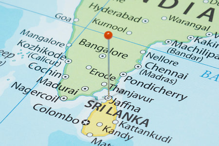 Close up to a Jaffna city with an orange pin needle into Sri Lanka country political mapの写真素材