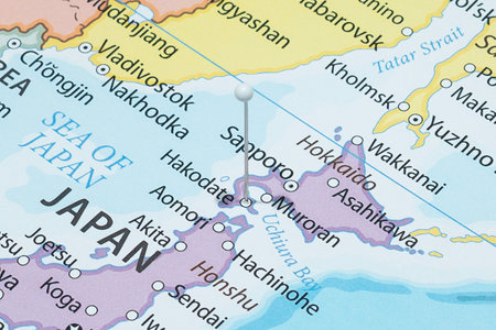 Close up to a Hakodate city with a white pin needle into Japan country political mapの写真素材