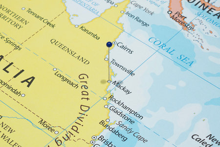 Close up to a Mackay city with a blue pin needle into Australia country political mapの写真素材