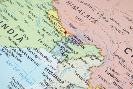 Close up to a Mymensingh city with a red pin needle into Bangladesh country political mapの写真素材