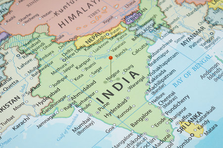 Close up to a Nagpur city with an orange pin needle into India country political mapの写真素材