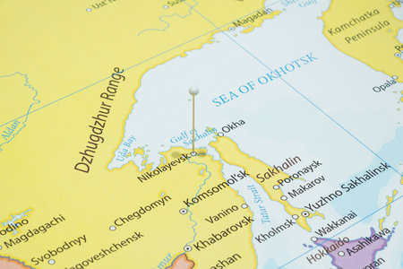 Close up to a Nikolayevsk city with a white pin needle into Russia country political mapの写真素材