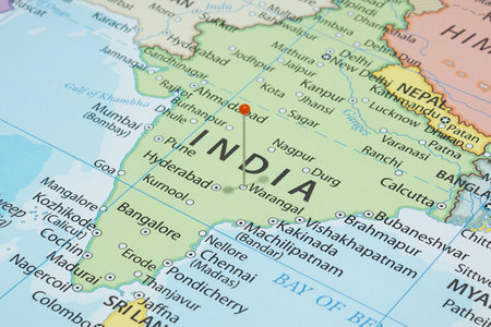 Close up to a Warangal city with an orange pin needle into India country political mapの写真素材