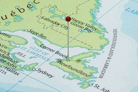 Close up to a Corner Brook city with a red pin needle into Canada country political mapの写真素材