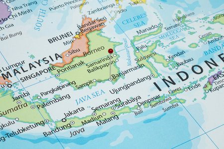 Close up to a Banjarmasin city with a red pin needle into Indonesia country political mapの写真素材