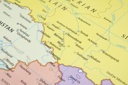 Close up to a Biysk city with a white pin needle into Russia country political mapの写真素材